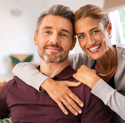 Happy smiling couple after successful root canal treatment in Oshawa, ON.