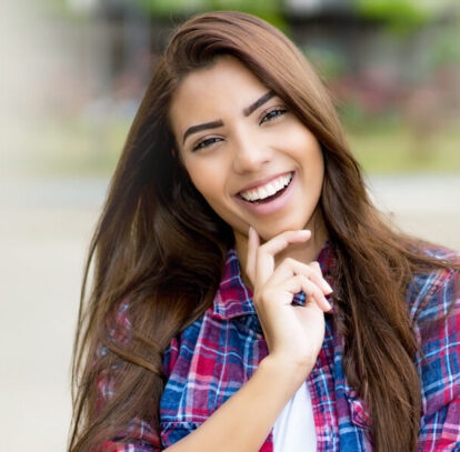 Smiling girl with beautiful teeth after altering the look and feel with dental bonding in Oshawa, ON.