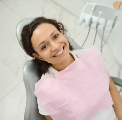 Beautiful smiling girl in dentist office to know more about dental inaly and onlay in Oshawa, ON.