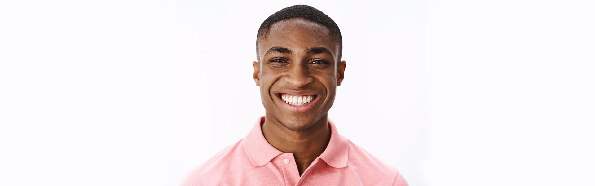 Boy smiling confidently after getting dental implants in Oshawa, ON.